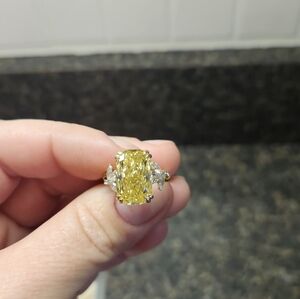 7.87 YELLOW CUSHION CUT DIAMOND RING.